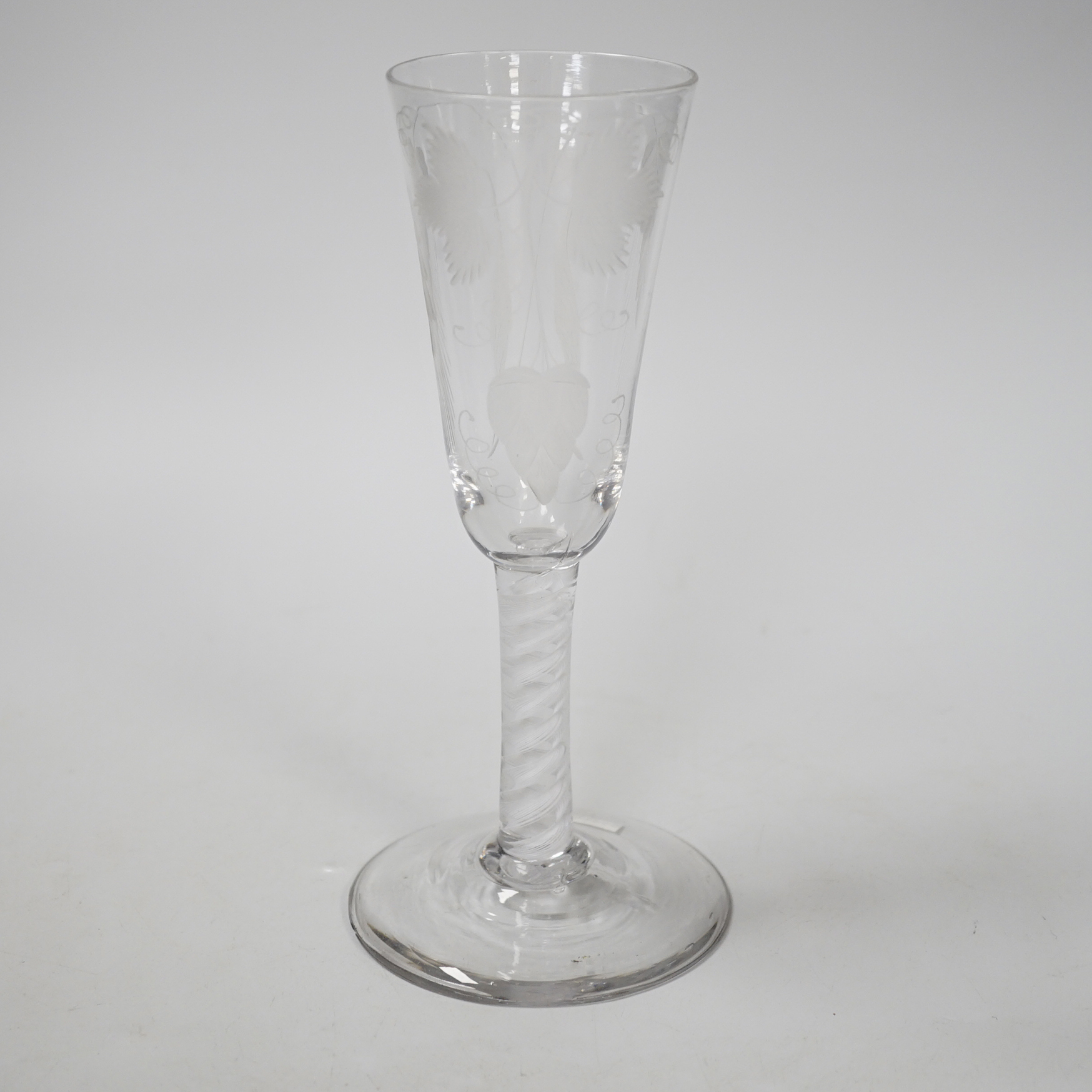 An English lead crystal SSOT ale glass, c.1760, the elongated round funnel bowl engraved with hops and barley, the stem with a rare SSOT scrambled eighteen ply spiral band, conical foot, snapped pontil, tool marked and s